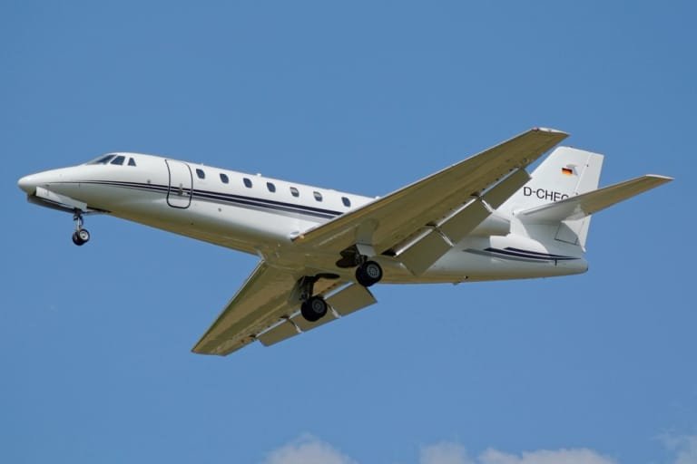Cessna Citation midsize jet climbing after take-off